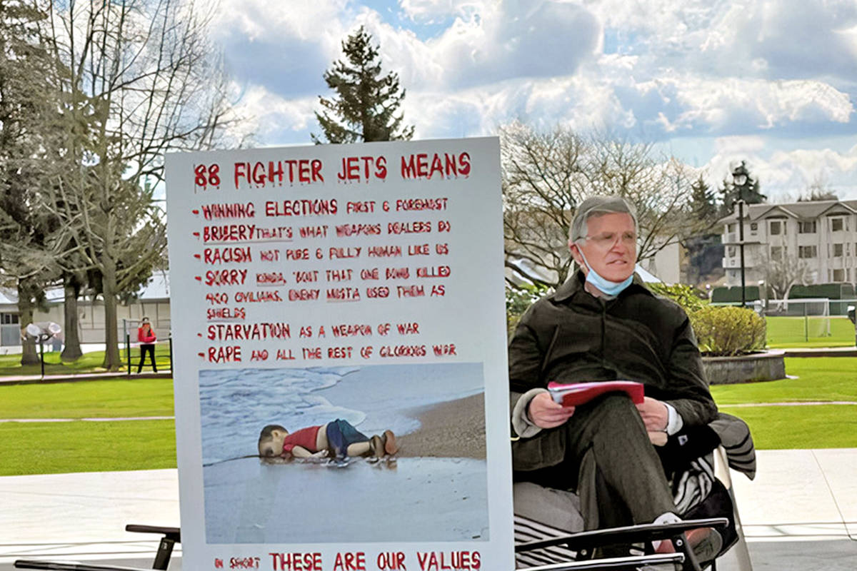 For the first seven days of his protest fast, Langley doctor Brendan Martin spent six hours every day in Langley City’s Douglas Park with protest signs. He was part of a cross-Canada campaign against fighter jet funding (Special to Black Press Media)