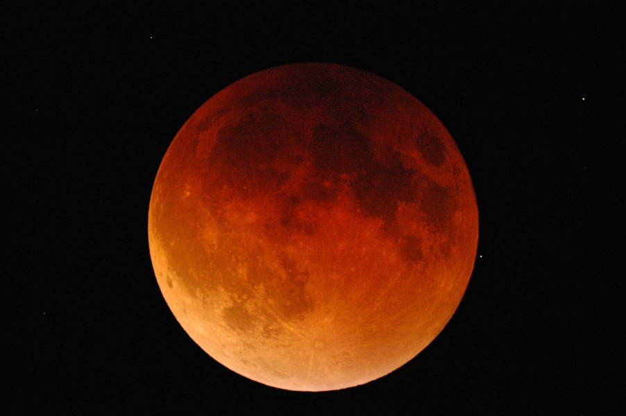 A photo by Rick Nowell of the last total lunar eclipse of 27 Sep 2015 in Cranbrook. The umbra is the dark central shadow cone cast by the Earth, about 2.5 times the size of the moon. The penumbra is the half shadow ring that surrounds the central cone, about the size of the moon. And at the centre of the umbra, the earth’s atmosphere layer casts a red glow, like a sunset. The atmosphere absorbs or scatters the other colours, and mainly red passes through.