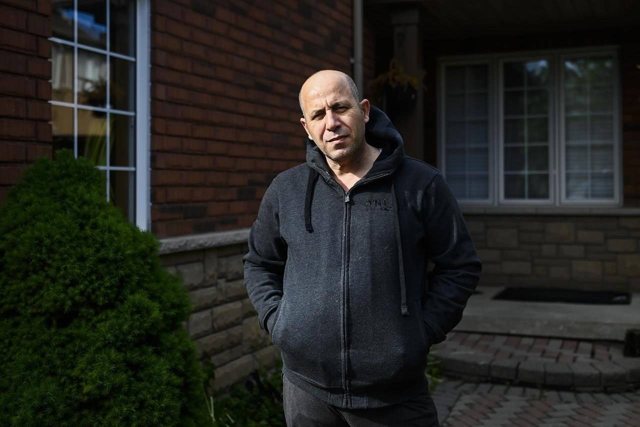 Abdallah Alhamadni poses for a photograph at his home in Mississauga, Ont., on Saturday, May 29, 2021. Alhamadni has a wife and two children in Gaza. THE CANADIAN PRESS/Nathan Denette