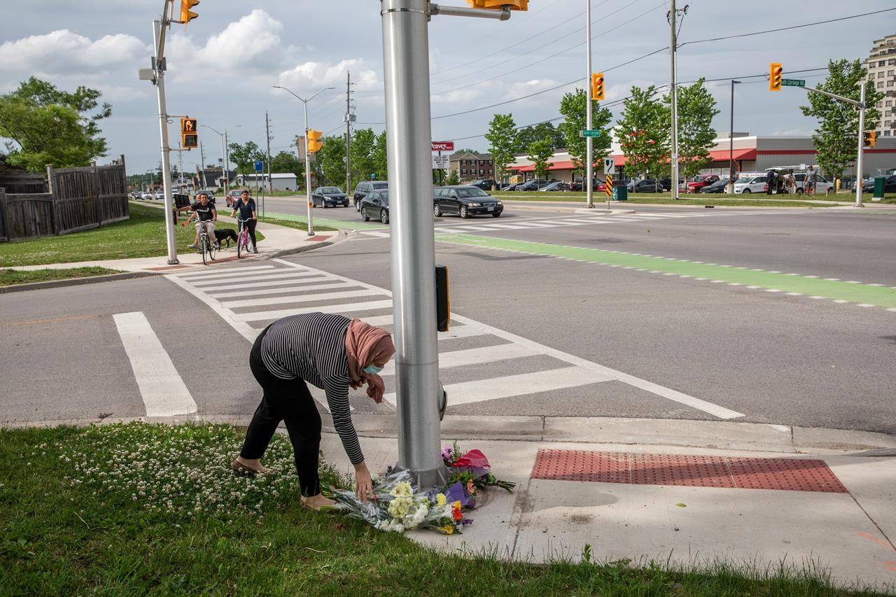 People show up to the location where a family of five was hit by a driver, in London, Ont., Monday, June 7, 2021. Four of the members of the family died and one is in critical condition. A 20 year old male has been charged with four counts of first degree murder and count of attempted murder in connection with the crime. THE CANADIAN PRESS/Brett Gundlock