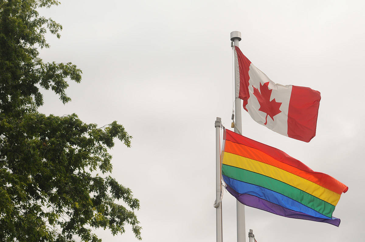 The rainbow flag flies beside the Canadian flag outside the University of the Fraser Valley’s Chilliwack campus on June 26, 2020. Monday, June 14, 2021 is Flag Day, and also June is Pride Month. (Jenna Hauck/ Chilliwack Progress file)