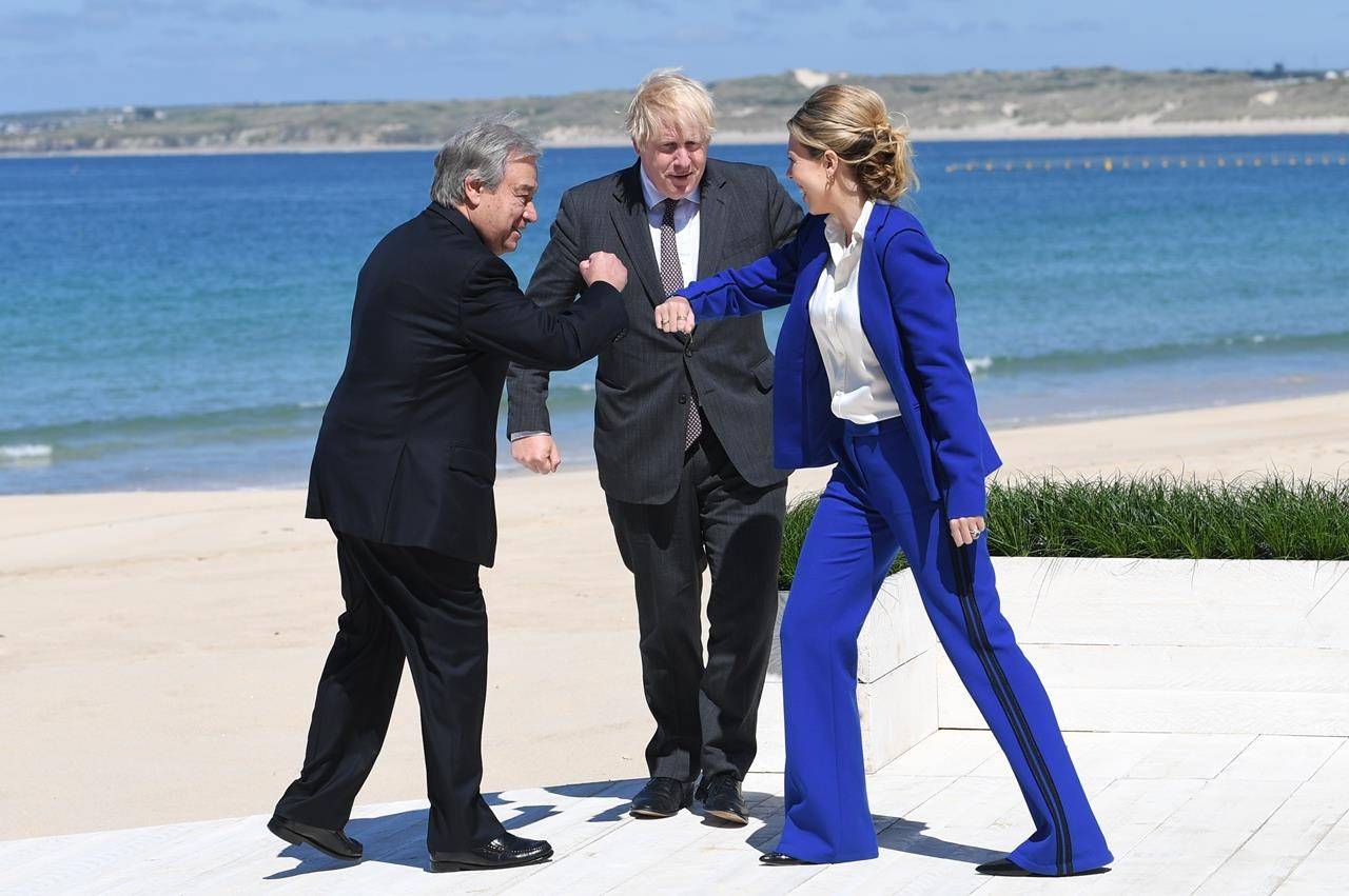 British Prime Minister Boris Johnson and his wife Carrie greet United Nations Secretary General Antonio Guterres, left, during arrivals for the G7 meeting in Carbis Bay, St. Ives, Cornwall, England, Saturday, June 12, 2021. Leaders of the G7 gathered for a second day of meetings on Saturday, in which they will discuss COVID-19, climate, foreign policy and the economy. (Stefan Rousseau/Pool via AP)