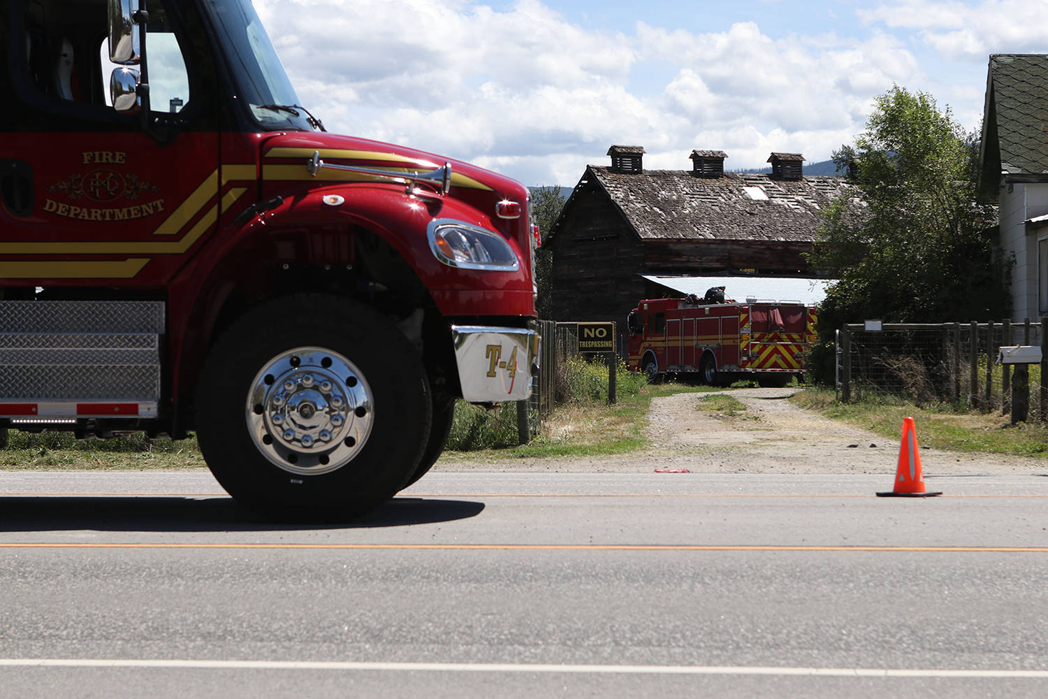 Fire trucks parked near the McEachern Tobacco Barn on Wednesday, June 16.(Aaron Hemens/Capital News)
