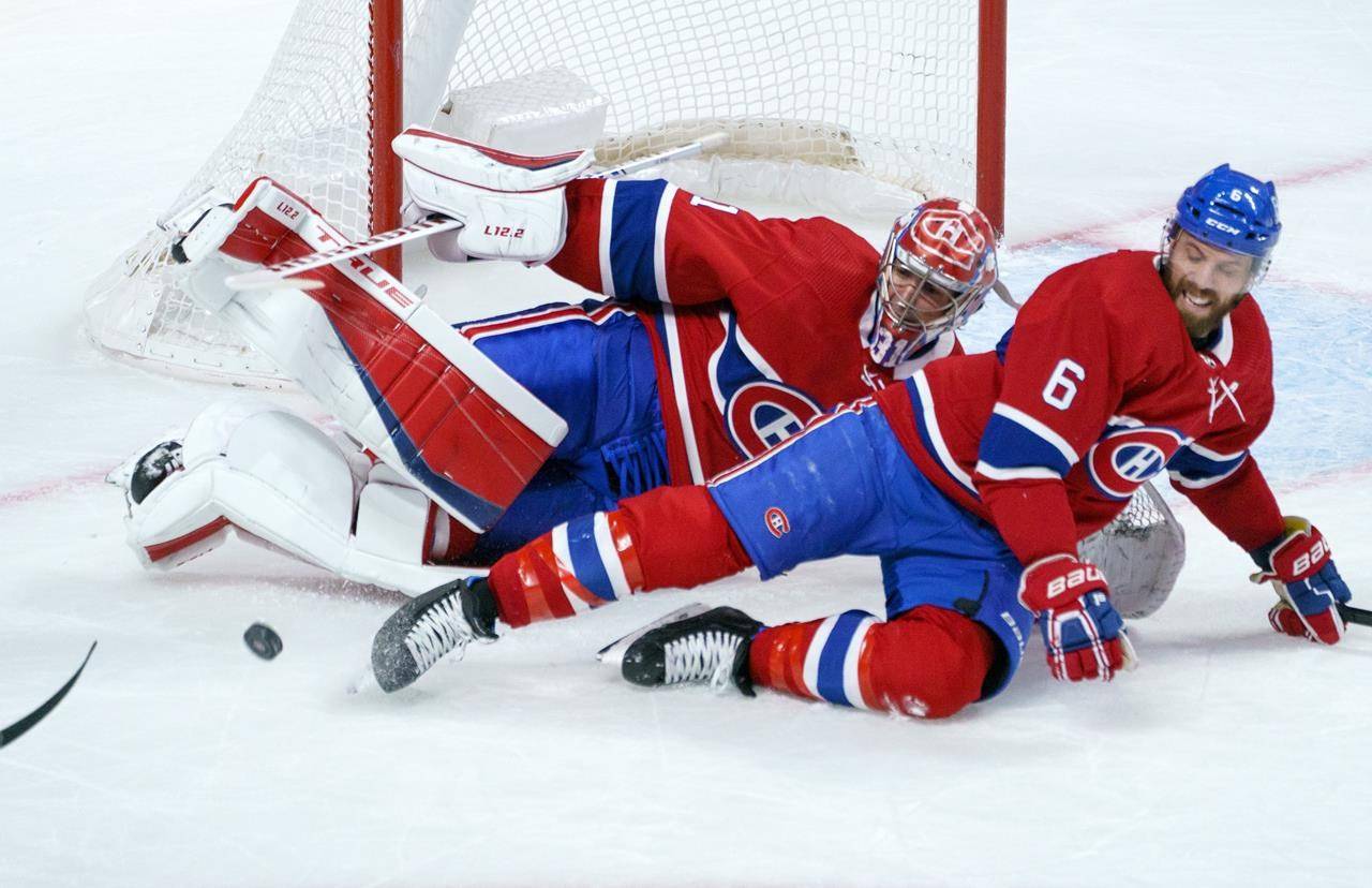 Montreal Canadiens goaltender Carey Price and defenceman Shea Weber fall after colliding during second period NHL hockey action against the Edmonton Oilers, in Montreal on Monday, April 5, 2021. (The Canadian Press - Paul Chiasson)