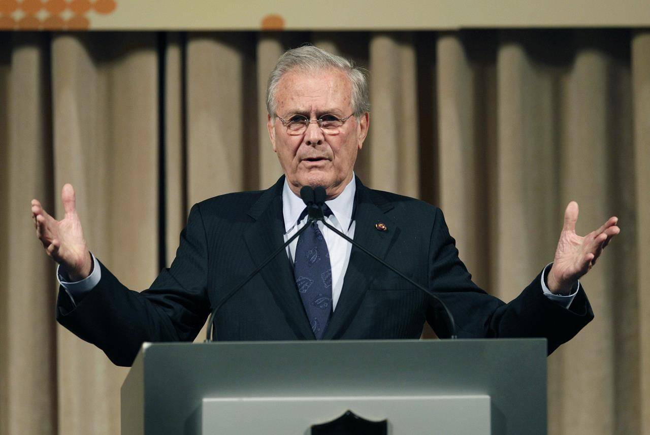 FILE - In this Oct. 11, 2011, file photo, former U.S. Secretary of Defense Donald Rumsfeld speaks to politicians and academics during a luncheon on security in rising Asia, in Taipei, Taiwan. (AP Photo/Wally Santana, File)
