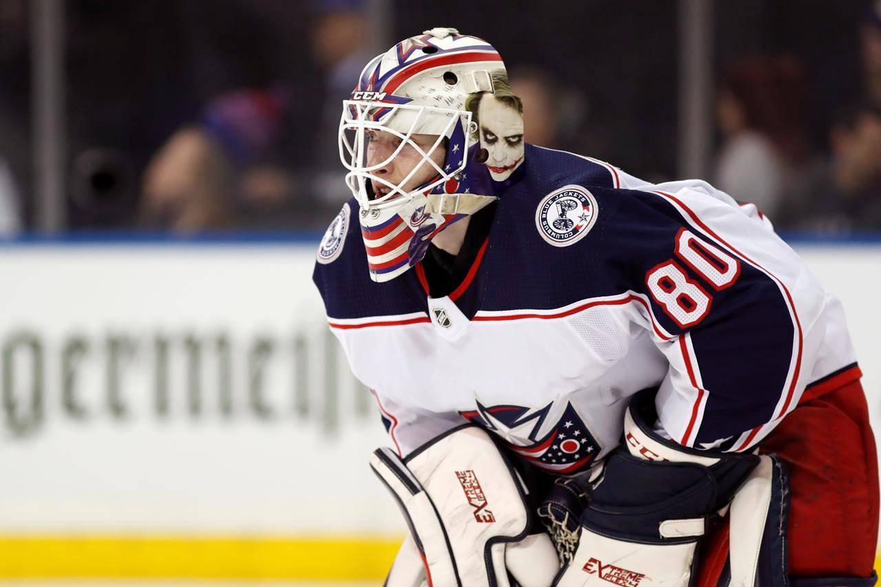 FILE - Columbus Blue Jackets goaltender Matiss Kivlenieks (80) is shown during the second period of an NHL hockey game in New York, in this Sunday, Jan. 19, 2020, file photo. The Columbus Blue Jackets and Latvian Hockey Federation said Monday, July 5, 2021, that 24-year-old goaltender Matiss Kivlenieks has died. The team said in a statement Kivlenieks died from an apparent head injury in a fall after medical personnel arrived. It was not immediately clear what caused the fall or where he was at the time of the incident, and multiple messages were left with team and national federation personnel that were not immediately returned.(AP Photo/Kathy Willens, File)