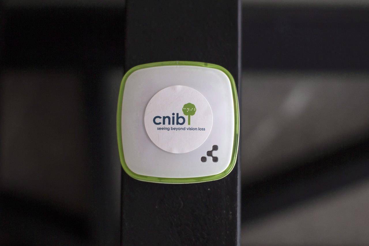 A Beacon with the logo of the CNIB is pictured on a wall in the group’s hub in Toronto’s Yonge and St.Clair neighbourhood, Friday, July 14, 2017. The CNIB says the federal government’s new ArriveCAN app is inaccessible to some Canadians. THE CANADIAN PRESS/Chris Young