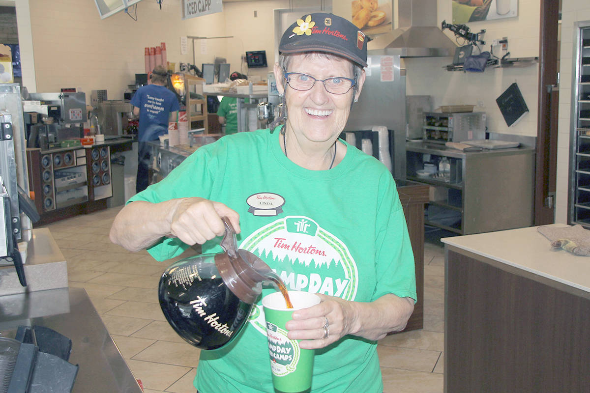 Linda Fedyniak is ready to pour coffee for the 27th annual Tim Hortons Camp Day next Wednesday. (Kevin Mitchell/Morning Star)