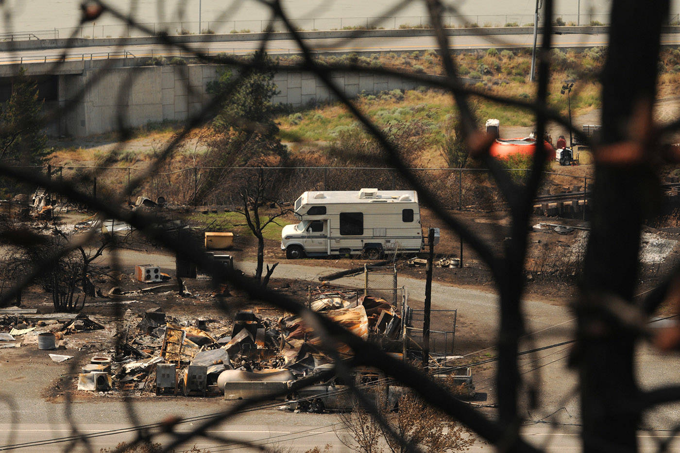 A motorhome sits amid the burnt debris in the Village of Lytton, B.C. on Friday, July 9, 2021 following a massive wildfire that tore through the town destroying 90 per cent of it. (Jenna Hauck/ Black Press Media)