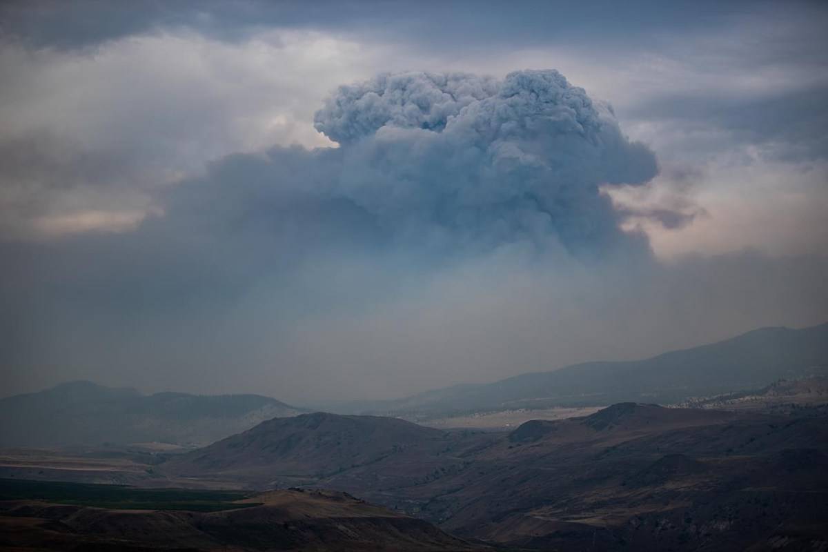 A pyrocumulus cloud, also known as a fire cloud, forms in the sky as the Tremont Creek wildfire burns on the mountains above Ashcroft, B.C., on Friday, July 16, 2021. THE CANADIAN PRESS/Darryl Dyck