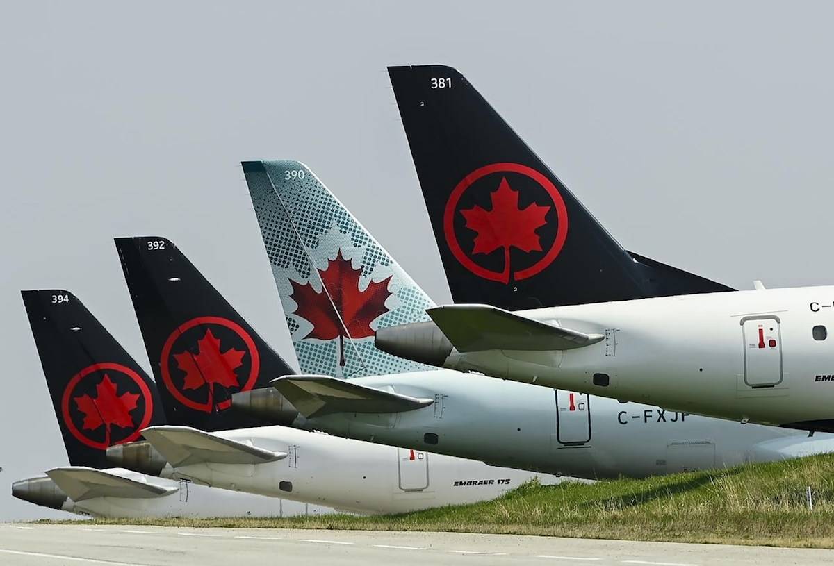 Grounded Air Canada planes sit on the tarmac at Pearson International Airport during the COVID-19 pandemic in Toronto on Wednesday, April 28, 2021. THE CANADIAN PRESS/Nathan Denette