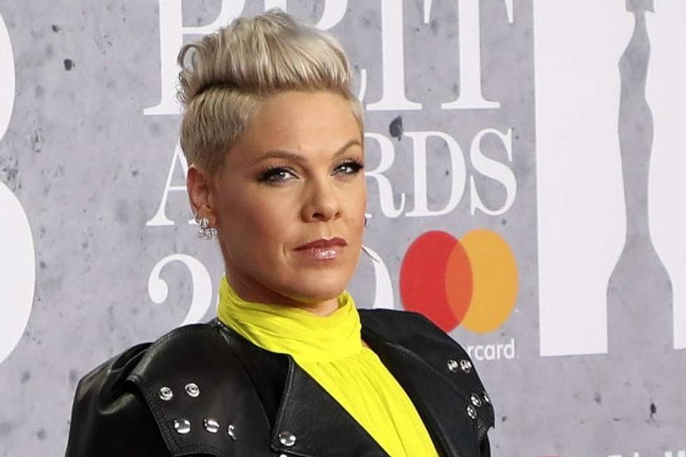 FILE - In Wednesday, Feb. 20, 2019 file photo, singer Pink poses for photographers upon arrival at the Brit Awards in London. U.S. pop singer Pink has offered to pay a fine given to the Norwegian female beach handball team for wearing shorts instead of the required bikini bottoms. Pink said she was “very proud” of the team for protesting against the rule that prevented them from wearing shorts like their male counterparts. At the European Beach Handball Championships in Bulgaria last week, Norway’s female team was fined 1,500 euros ($1,770) for what the European federation called improper clothing and “a breach of clothing regulations.” (Photo by Vianney Le Caer/Invision/AP, File)