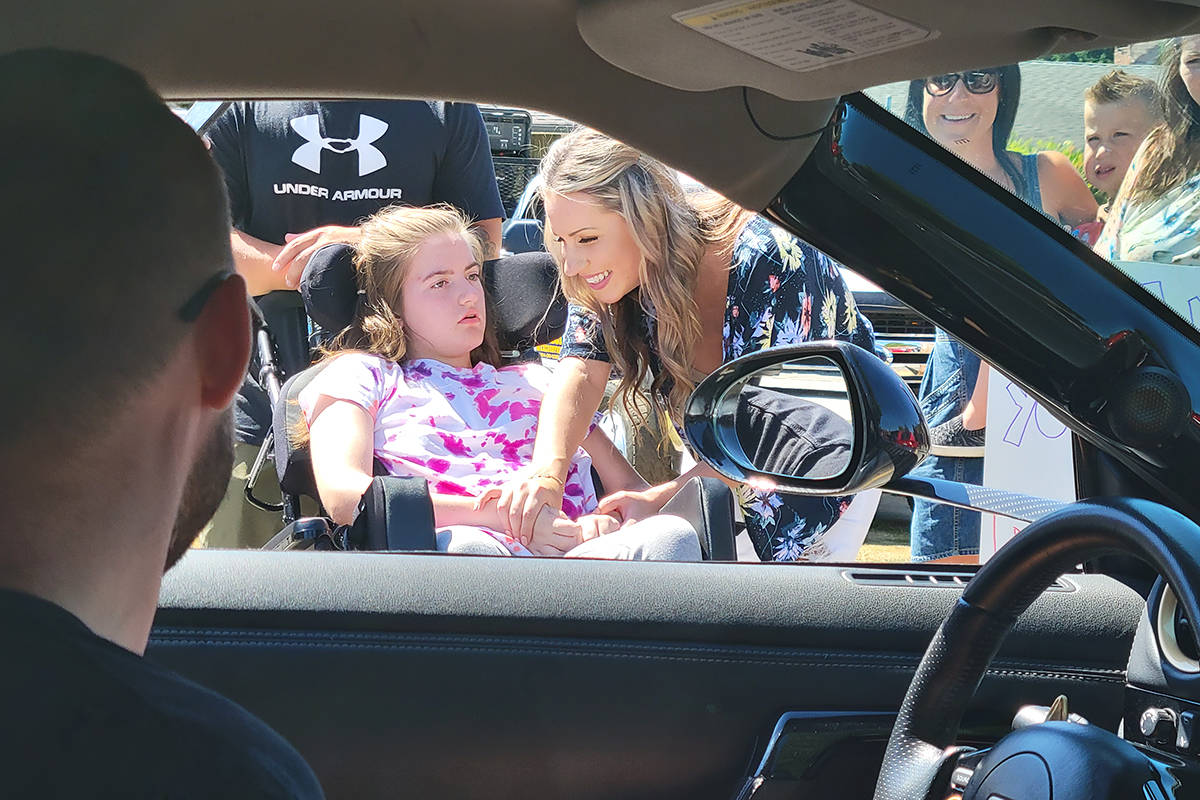 Langley City teen Alyssa Anderson and mom Courteny had a look inside a supercar on Sunday, July 25, as part of the Drive Project that aims to bring a little motorized magic to special kids. (Dan Ferguson/Langley Advance Times)