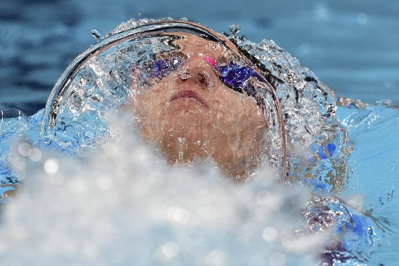 Regan Smith of the United States swims in the final of the women's 100-meter backstroke at the 2020 Summer Olympics, Tuesday, July 27, 2021, in Tokyo, Japan. (AP Photo/Matthias Schrader)