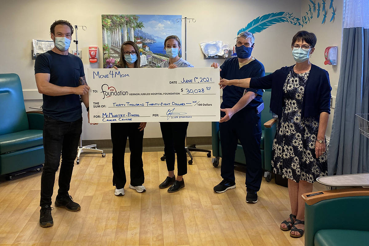 Vernon’s Oliver Stankiewicz (left) presents a cheque for $30,028 to Vernon Jubilee Hospital Foundation director Kate McBrearty (right), and representatives of the hospital’s McMurtry-Baerg Cancer Centre Stacy Nelson (from left), Kristen Megyesi and Dr. Ed Hardy. Stankiewicz raised the money and ran 101 kilometres in memory of his mom, who died of uterine cancer in 2020. (Contributed)