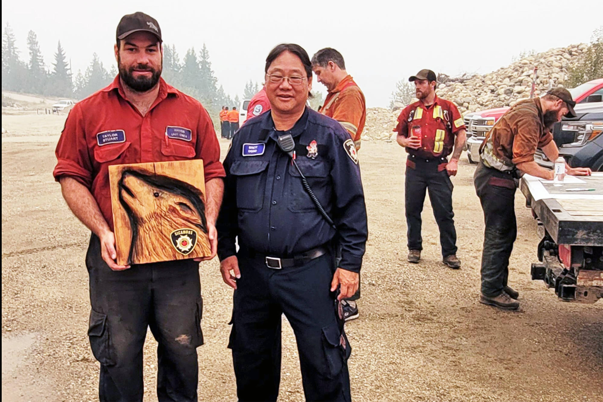 Sicamous Fire Chief Brett Ogino expresses his gratitude to Taylor Stuart and the Rhinos wildfire crew, which had been working on the Two Mile Road wildfire south of Sicamous. (Sicamous Fire Department photo)