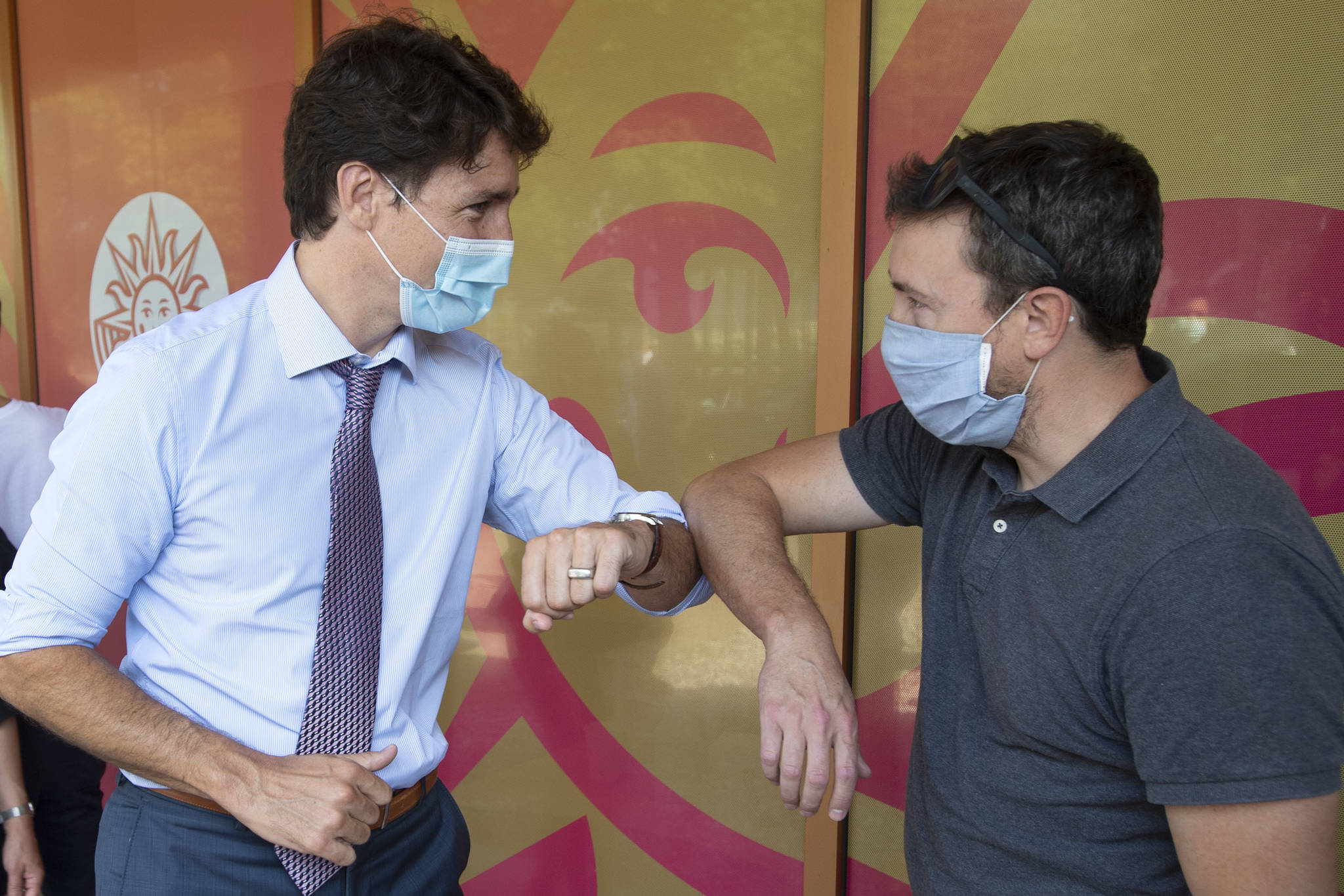 Prime Minister Justin Trudeau greets people waiting for their shots while visiting a COVID-19 vaccination clinic Thursday, July 15, 2021 in Montreal.THE CANADIAN PRESS/Ryan Remiorz