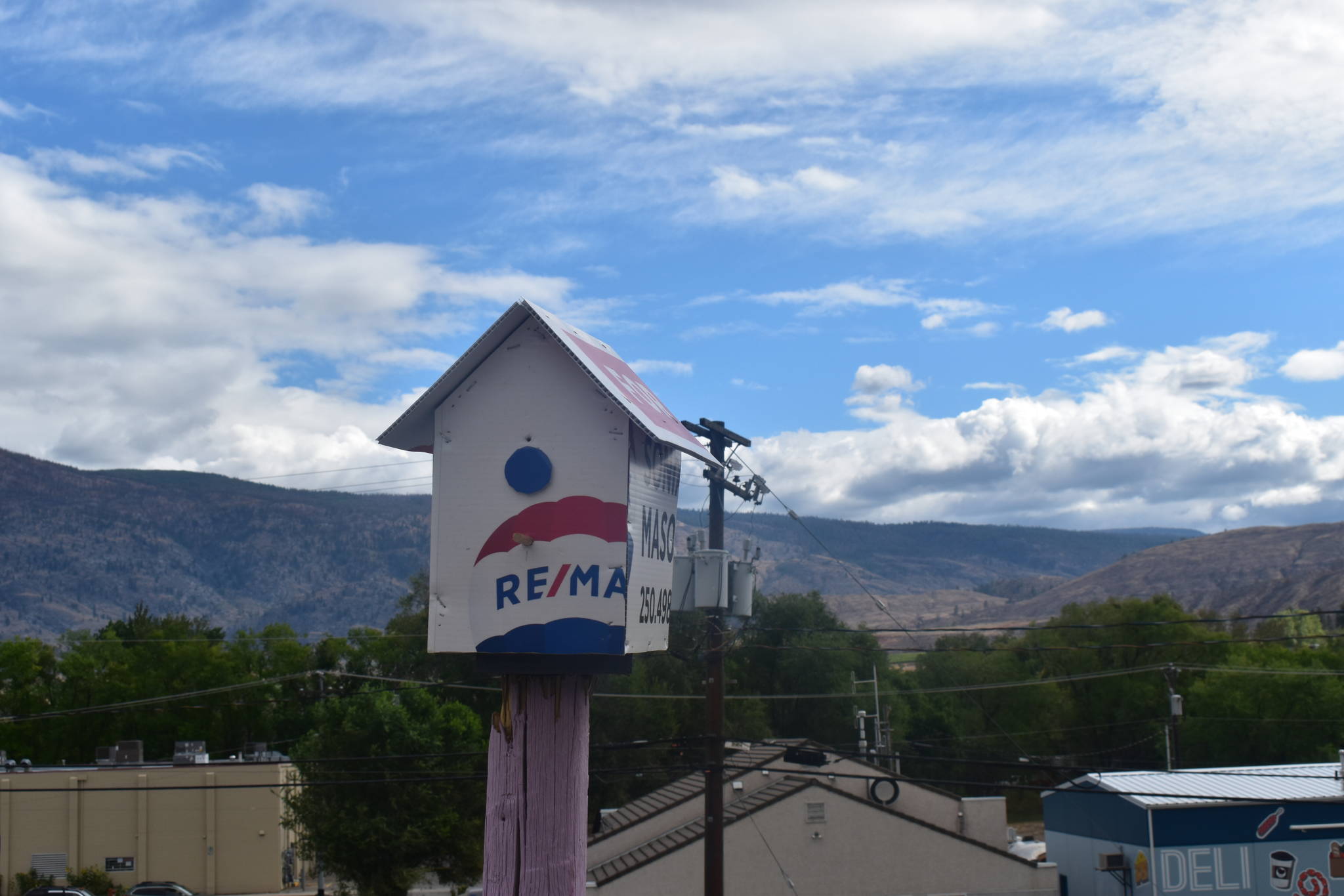 A birdhouse made from a realty sign to represent the border to owning a home (Clayton Whitelaw/Penticton Western News)