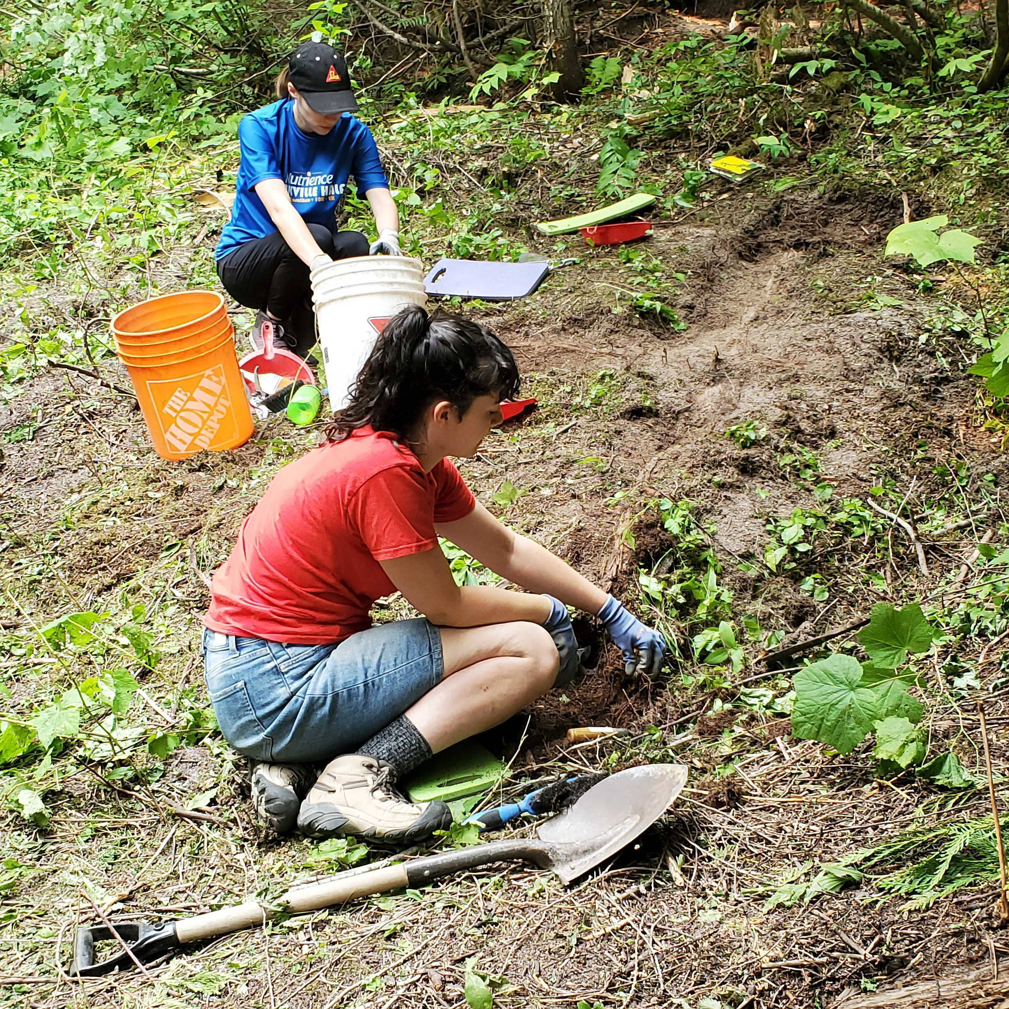 Volunteer university students Keagan Edwards of Port Moody (top) and Holly O’Neil of Maple Ridge search for artifacts at the site of the First World War Monashee Internment Camp east of Cherryville. (Roger Knox - Morning Star)
