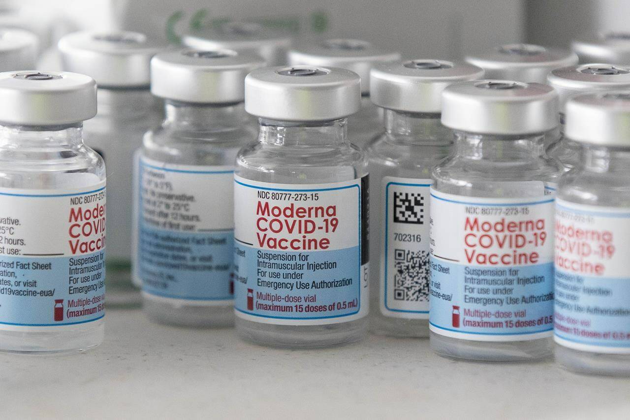Empty Moderna vaccine vials are shown before a COVID-19 vaccine drive-thru clinic at Richardson stadium in Kingston, Ont., on Friday, July 2, 2021. THE CANADIAN PRESS/Lars Hagberg