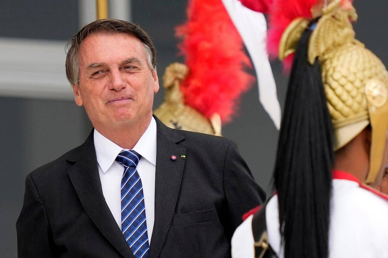 Brazilian President Jair Bolsonaro waits for the arrival of Colombia's President Ivan Duque to Planalto presidential palace in Brasilia, Brazil, Tuesday, Oct. 19, 2021. Duque is on a two-day visit to Brazil. (AP Photo/Eraldo Peres)