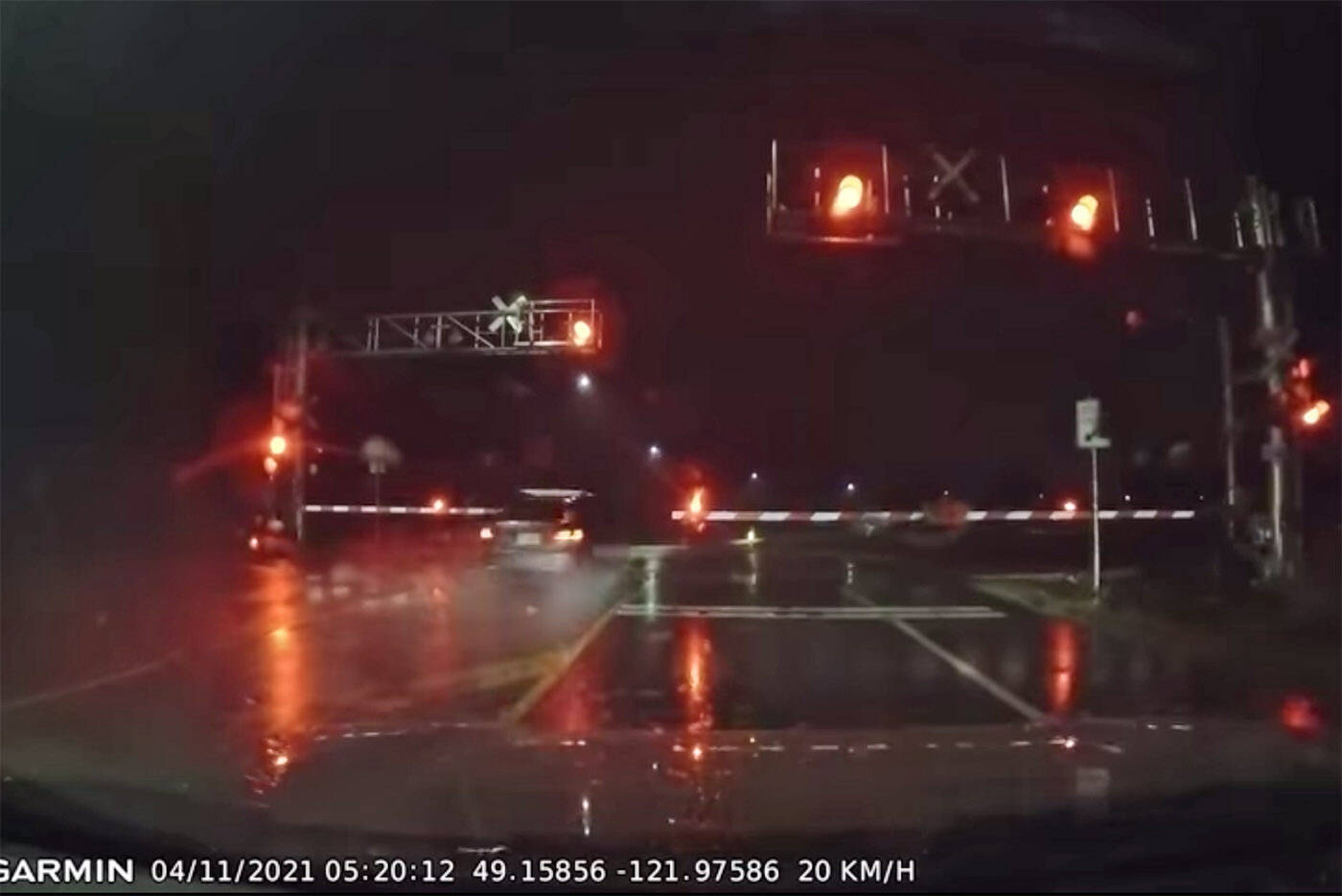 In this screen grab, a vehicle is seen racing through a CN Rail crossing in Chilliwack on the morning of Thursday, Nov. 4, 2021. The dashcam footage was captured by Mike Ervin. (Facebook/ Mike Ervin)