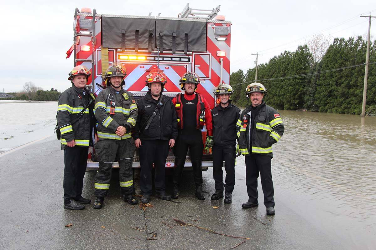 The crew from Abbotsford Fire Rescue Service after the man was safe. (Vikki Hopes/Abbotsford News)