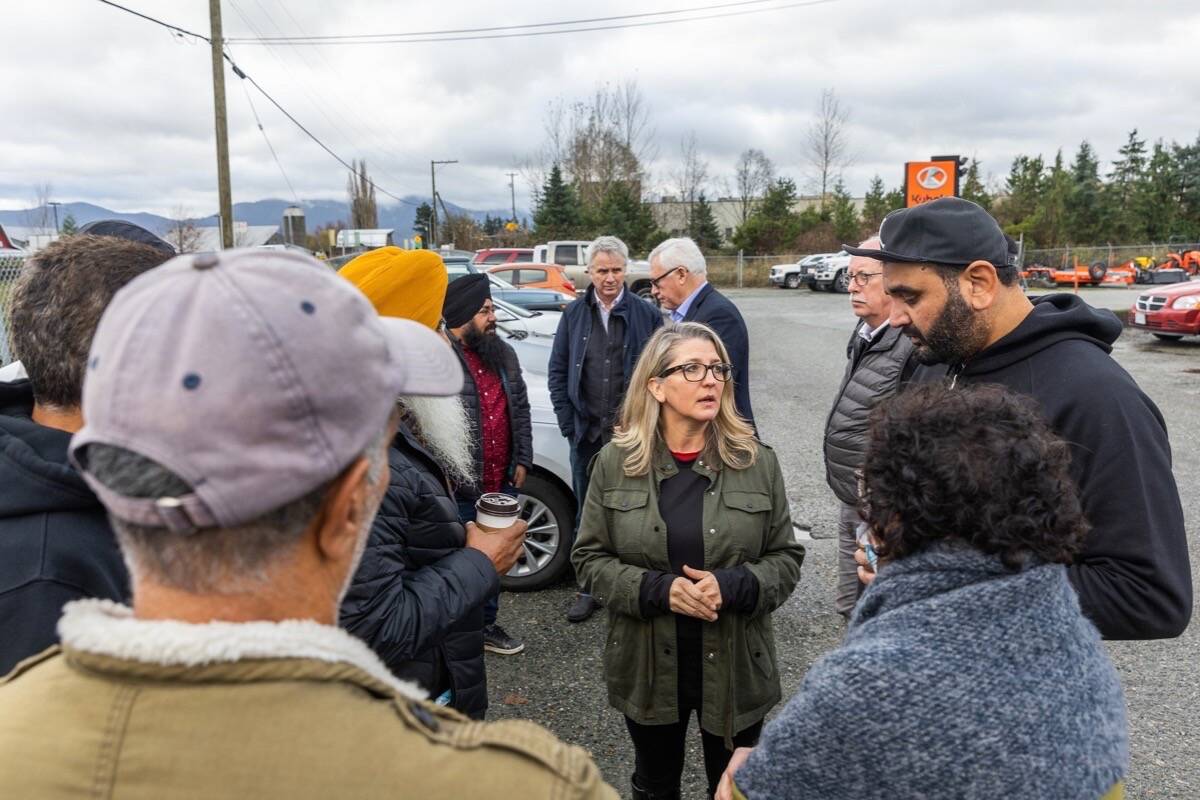 B.C. Agriculture Minister Lana Popham, Delta South MLA Ian Paton and Abbotsford Mayor Henry Braun meet with farmers from the Sumas Prairie, Nov. 23, 2021. (B.C. government photo)
