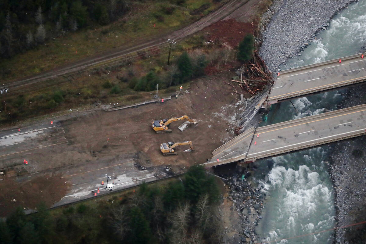 Work is being done on a section of the Coquihalla Highway after damage was caused by heavy rains and mudslides north of Hope, B.C., on Monday, November 22, 2021. THE CANADIAN PRESS/Darryl Dyck