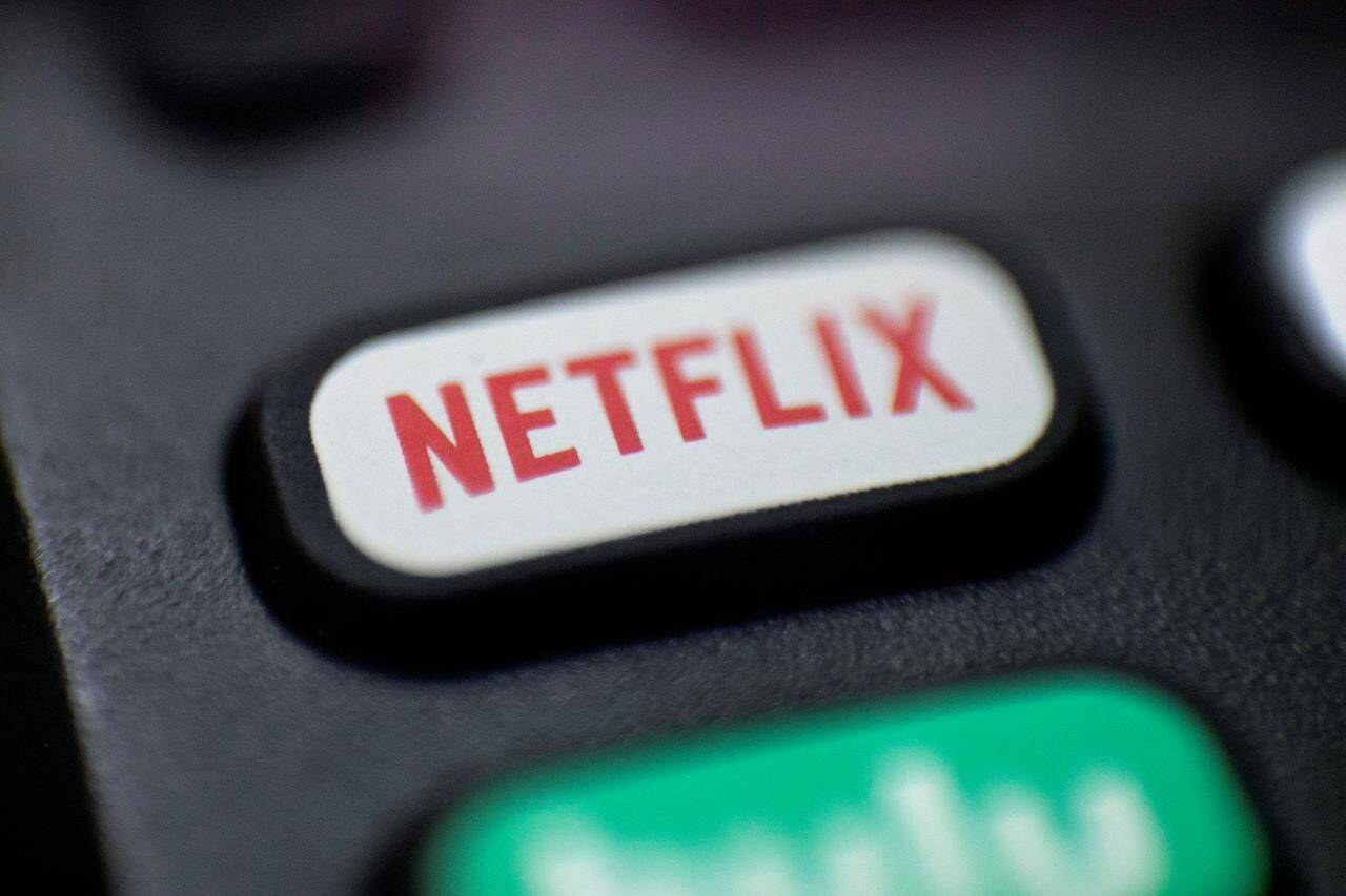 A logo for Netflix on a remote control in Portland, Ore. is shown on Aug. 13, 2020. With Parliament having resumed, Canadians can expect to see the Liberal government make the reintroduction of what was previously known as Bill C-10 a priority.THE CANADIAN PRESS/AP, Jenny Kane