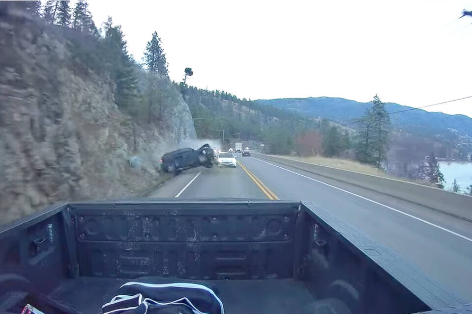 Brendan Miller’s dashcam caught an SUV driving over the centre lane, overtaking vehicles before losing control and slamming into the rocks on Highway 97 just outside of Peachland on Saturday, Nov. 27, 2021. (Brendan Miller video)