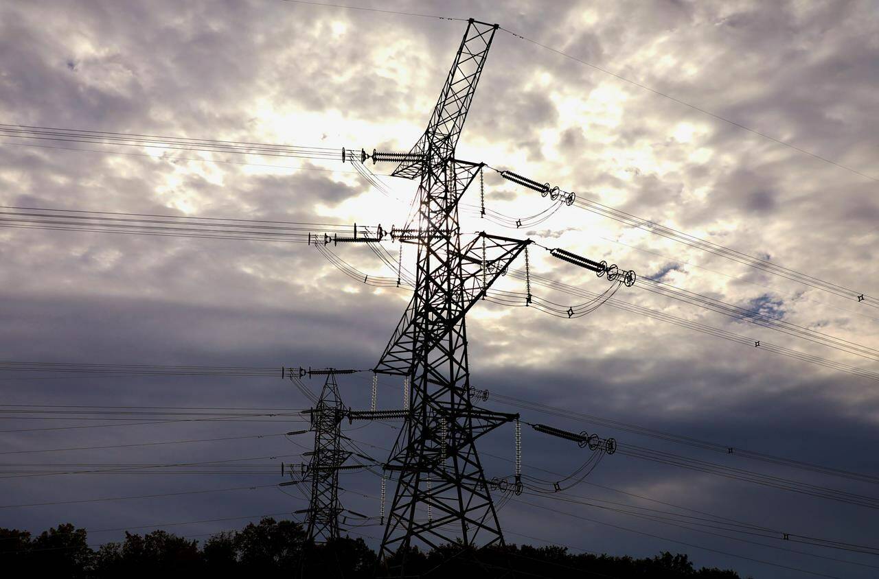 Electrical transmission lines are seen south of Chesley, Ont., on Sunday, Sept. 29, 2019. Investigators at the Alberta Utilities Commission want a probe into what they say is illegal behaviour by one of the province’s largest companies. THE CANADIAN PRESS/Colin Perkel