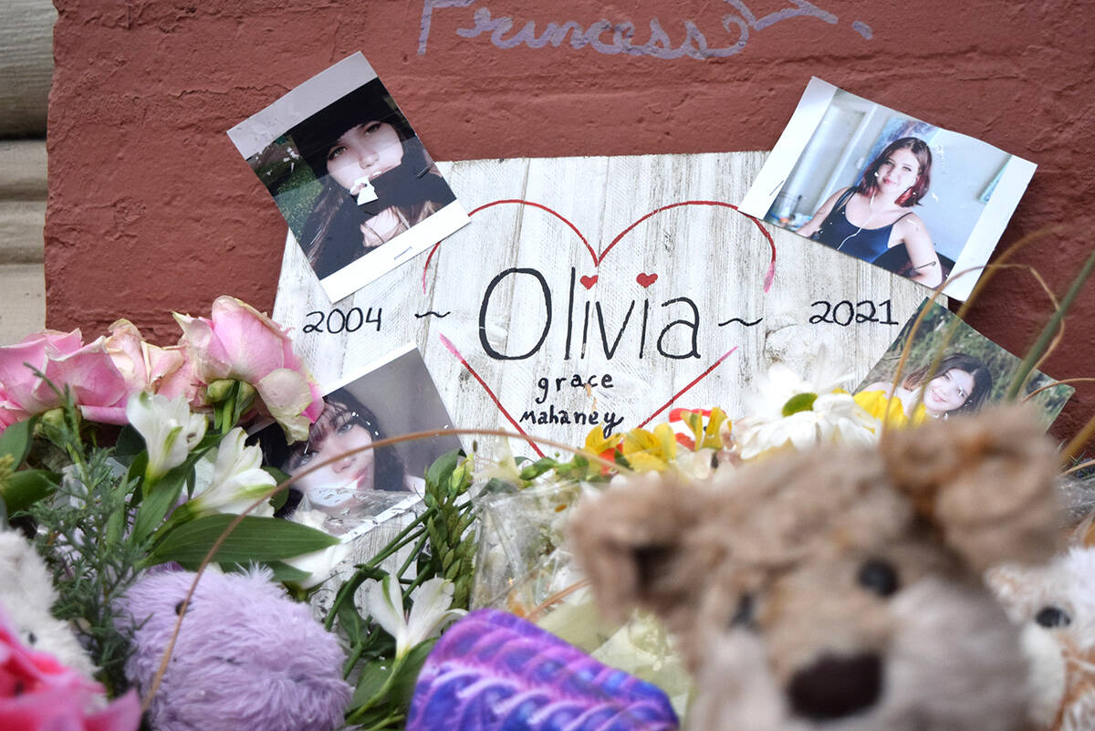 Flowers, stuffed animals and photos left in remembrance of 17-year-old Olivia Mahaney, who died of overdose at the corner of Wharf and Yates streets. (Kiernan Green/Victoria News Staff)