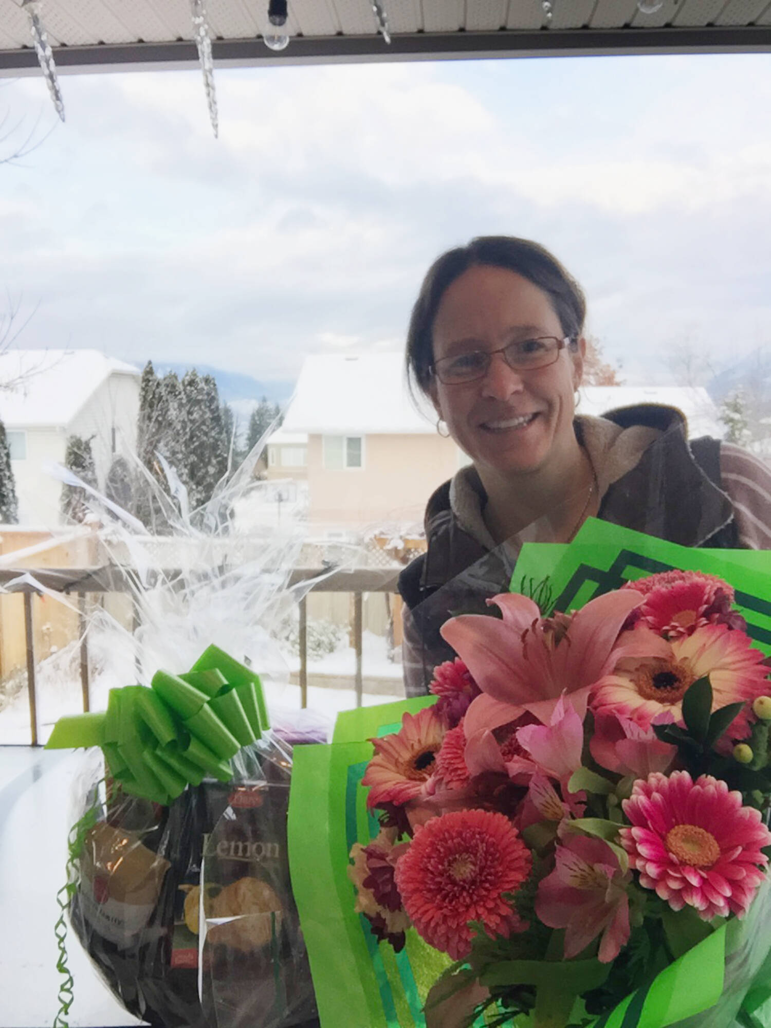 Salmon Arm resident Sara Mitchell was able to locate the intended recipient of a gift basket left at her house on Dec. 5. Now the recipient, Karen Whidden, is trying to find the person who made the initial delivery to say thanks. (Contributed)