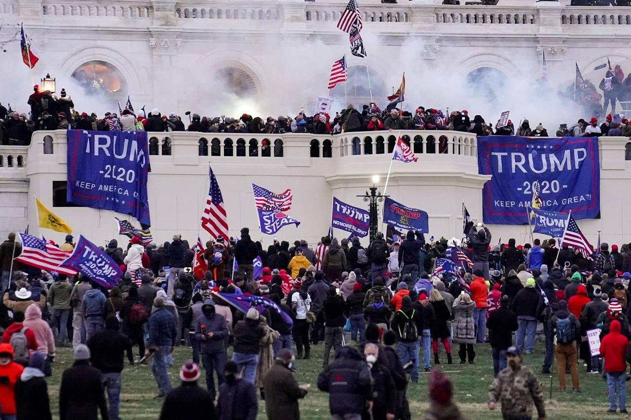 In this Wednesday, Jan. 6, 2021, file photo, violent rioters supporting President Donald Trump storm the Capitol in Washington. THE CANADIAN PRESS/AP-John Minchillo