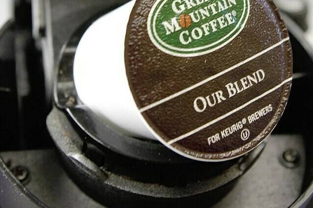 In this Oct. 7, 2010, file photo, a Green Mountain Coffee single-serving brewing cup is seen in a Keurig machine in Montpelier, Vt. The Competition Bureau says Keurig Canada will pay a $3 million penalty in Canada for making false or misleading claims that its single-use K-cup pods can be recycled. THE CANADIAN PRESS/AP-Toby Talbot, File