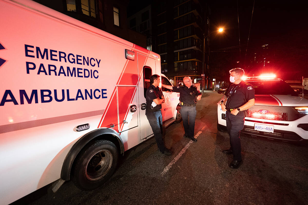 Paramedic Specialists Brian Twaites and David Hilder of B.C. Ambulance debrief after responding to a drug overdose in downtown Vancouver, Wednesday, June 23, 2021. Over the past several years the drug overdoses not only across British Columbia but throughout Canada have but grown. On June, 23, 2021 for instance B.C. Ambulance paramedics responded to 140 overdose calls across the province with 42 of those being just in Vancouver. THE CANADIAN PRESS/Jonathan Hayward