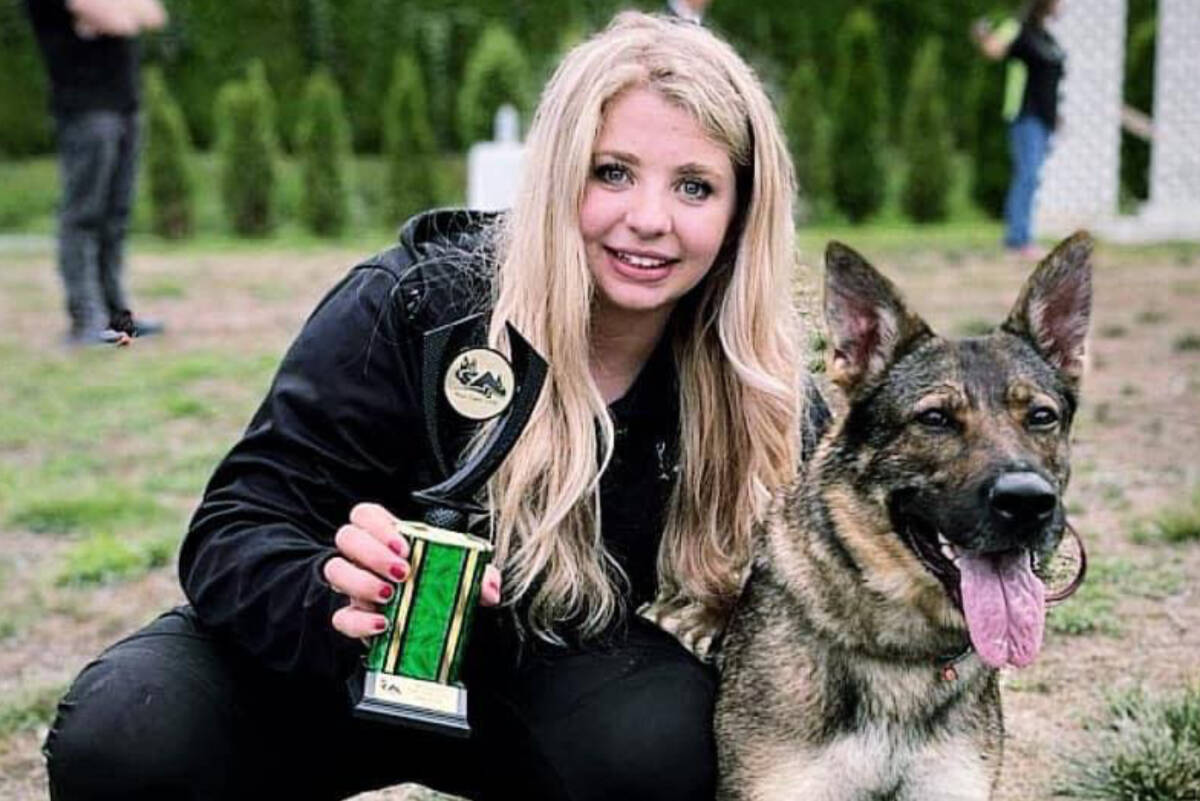 Melissa Hume and her German shepherd Shrimpy after winning High Place IGP 2 in International Working Dog Trial Regulations. (Special to The News)