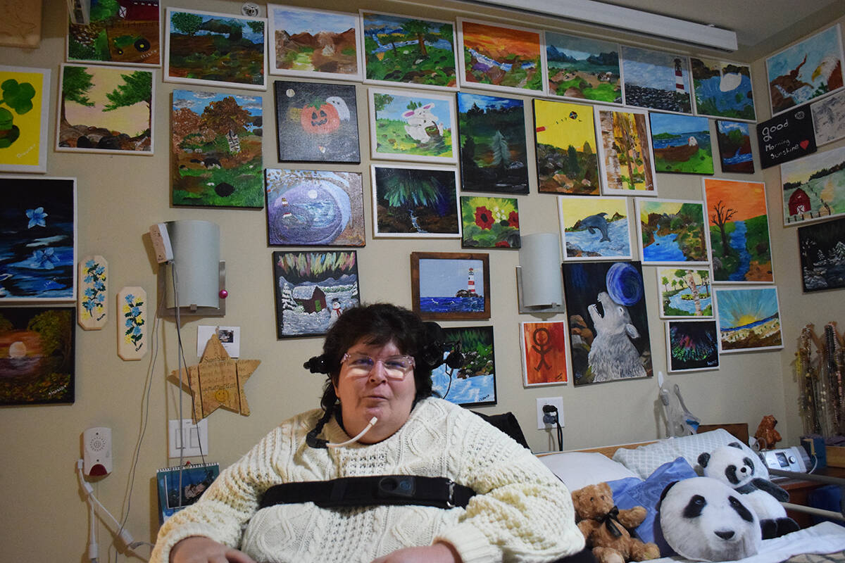 Shawna Magnusson has surrounded herself with delightfully colourful paintings of her own creation. Photo by Ronan O’Doherty/Campbell River Mirror