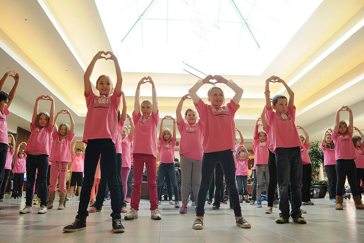 Grade 2-6 students from Evans elementary perform a flash mob to Ariana Grande’s song ‘Put Your Hearts up’ at Cottonwood Mall in Chilliwack on Pink Shirt Day (Anti-Bullying Day) on Wednesday, Feb. 26, 2014. This year’s Pink Shirt Day is Wednesday, Feb. 23, 2022. (Jenna Hauck/ Chilliwack Progress file)