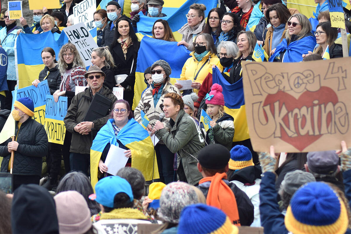 Tamara Krawchenko, a Ukrainian resident of Victoria, addresses a crowd of hundreds at the B.C. Legislature in support of Ukraine on Feb. 27, 2022. (Kiernan Green/News Staff)