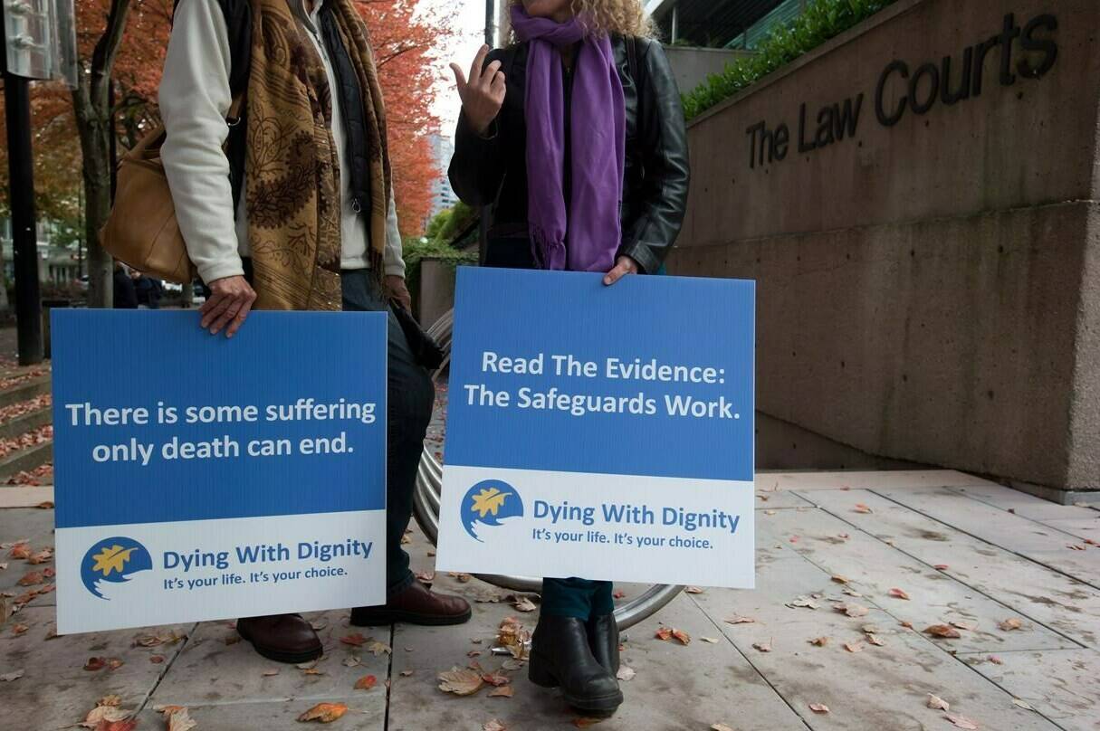 Assisted-suicide supporters wait outside the B.C. Court of Appeal before the court overturned a lower court ruling that said Canada's assisted-suicide ban violated the charter rights of gravely ill Canadians, in Vancouver, B.C., on Thursday October 10, 2013. THE CANADIAN PRESS/Darryl Dyck