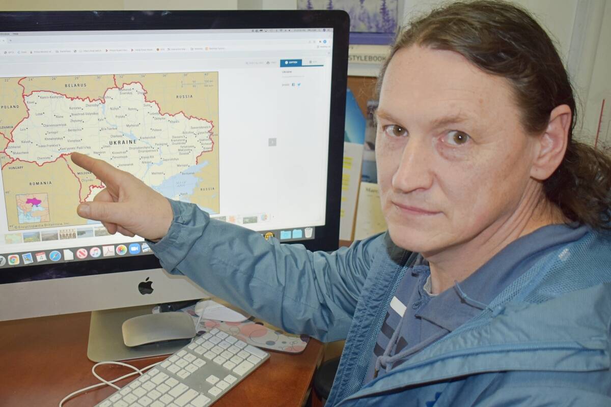 Prince Rupert resident, Anatolii Levkovytskyi, points to his home city in Ukraine on March 4, which has been destroyed by bombing and missile attacks where his brother is fighting on the front lines. (Photo: K-J Millar/The Northern View)