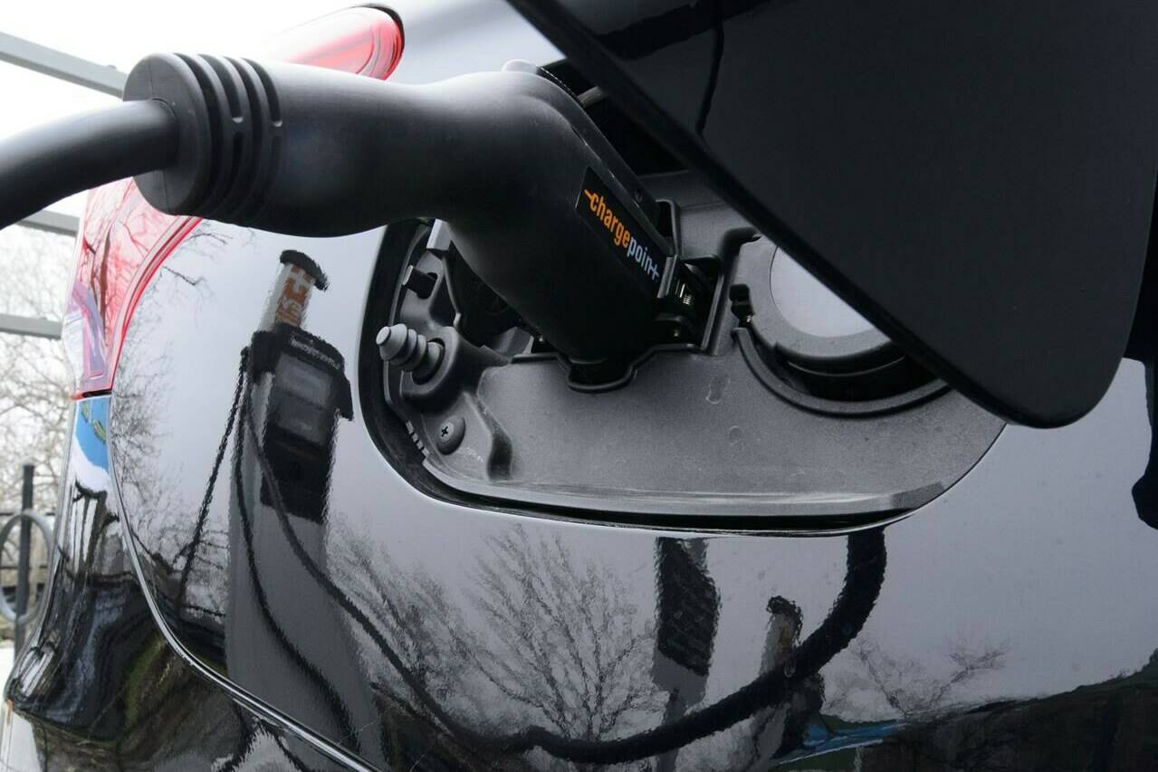 A car is charged at a charge station for electric vehicles on Parliament Hill in Ottawa on Wednesday, May 1, 2019. THE CANADIAN PRESS/Sean Kilpatrick