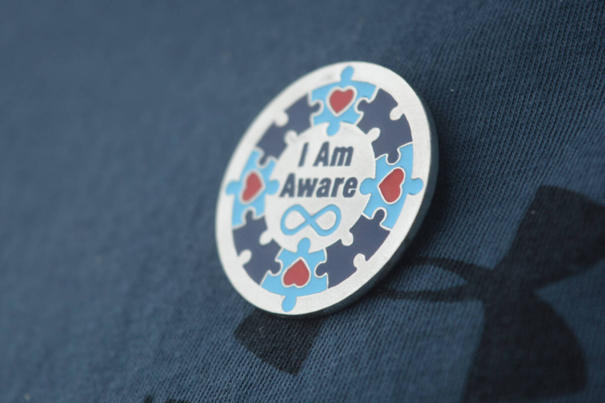 The 2022 pin design incorporates both an infinity symbol and puzzle pieces, which have both been used as a symbol for autism awareness. (Cassidy Dankochik Photo - Quesnel Cariboo Observer)