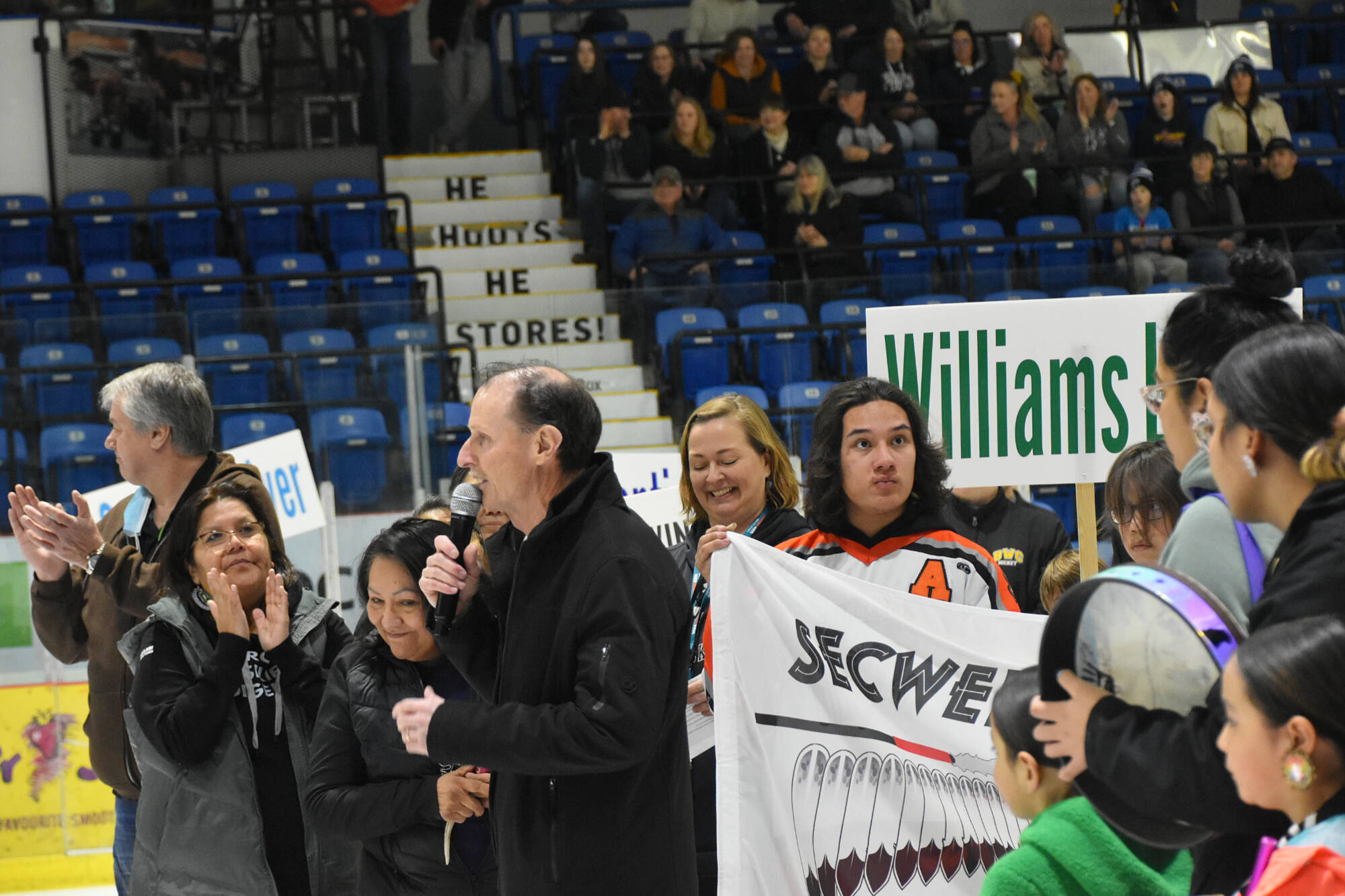 Salmon Arm Mayor Alan Harrison expresses his appreciation Sunday, March 20 for the Secwépemc flag now in the Spectator Arena at Shaw Centre, as well as welcoming all the teams who have come from all over B.C. to participate in the Tier2 U13 provincial championships, ongoing through March 23. (Martha Wickett - Salmon Arm Observer)