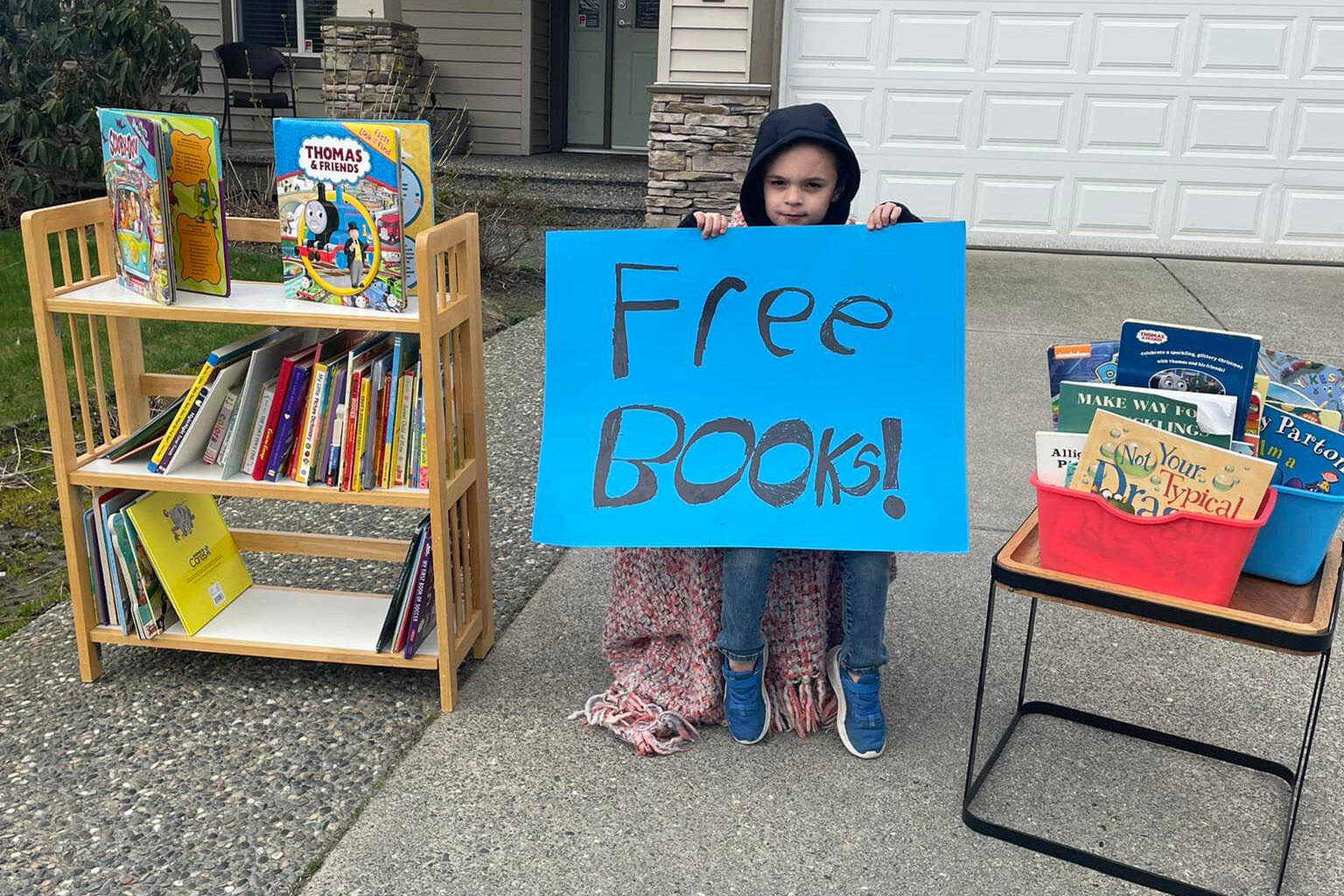 Jackson Kuhn, 7, of Chilliwack gave away a bunch of his books to other kids on Friday, March 25, 2022. (Jenn Kuhn photo)