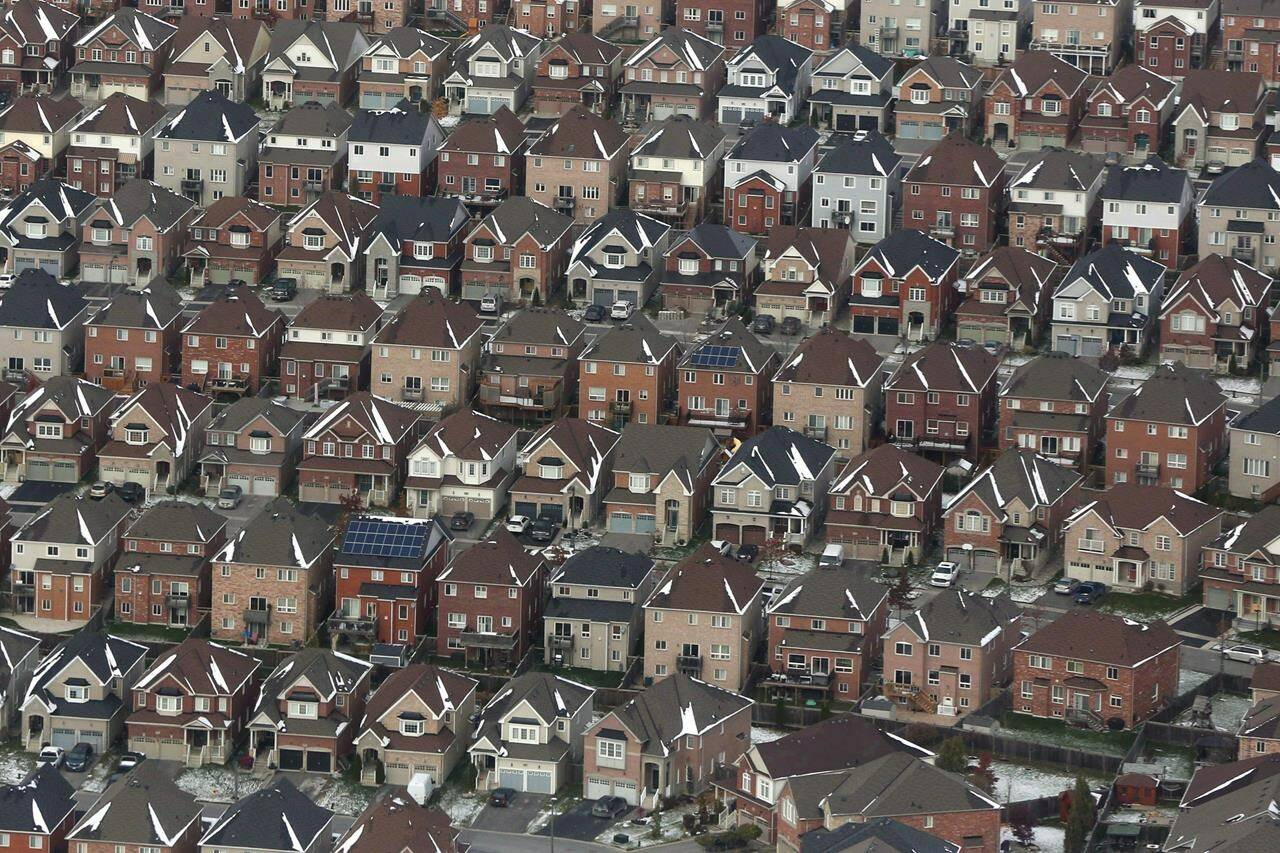 An aerial view of houses in Oshawa, Ont. is shown on Saturday, Nov. 11, 2017. New data from Statistics Canada shows multiple-property owners held between 30 and 40 per cent of the housing stock in Ontario, British Columbia, Nova Scotia and New Brunswick. THE CANADIAN PRESS/Lars Hagberg