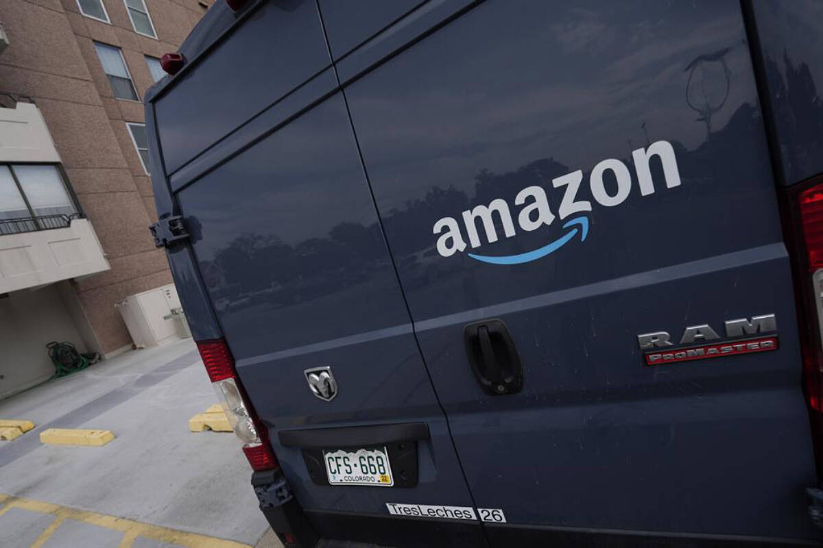 The company logo graces one of the doors of a delivery van for Amazon Wednesday, Sept. 1, 2021, in Denver. Amazon said Wednesday, April 13, 2022 it will add a 5% “fuel and inflation surcharge” to fees it charges third-party sellers who use the retailer’s fulfillment services as the company faces rising costs. The company said in an announcement on its website that the added fees will take effect on April 28 and are subject to change. Federal data released Tuesday showed inflation hit 8.5% in March, its fastest pace in more than 40 years. (AP Photo/David Zalubowski, file)