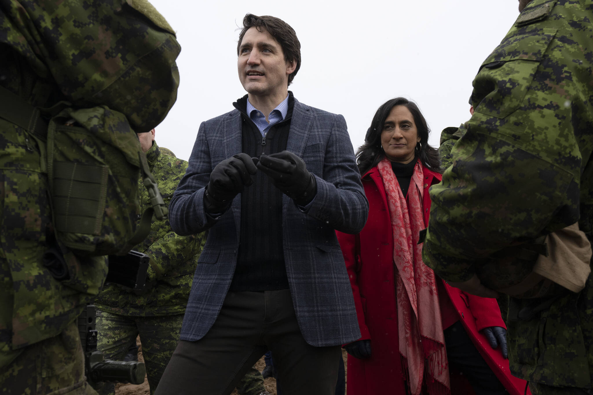 Canadian Prime Minister Justin Trudeau and Minister of Defence Anita Anand speak with Canadian troops deployed on Operation Reassurance as he visits the Adazi Military base in Adazi, Latvia, Tuesday, March 8, 2022. THE CANADIAN PRESS/Adrian Wyld